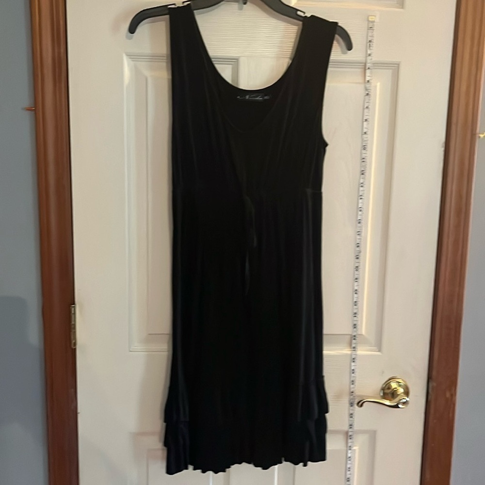 Neesha-M/L-black, sleeveless, pull over, ruffles at the bottom ,V-neck,dress.
